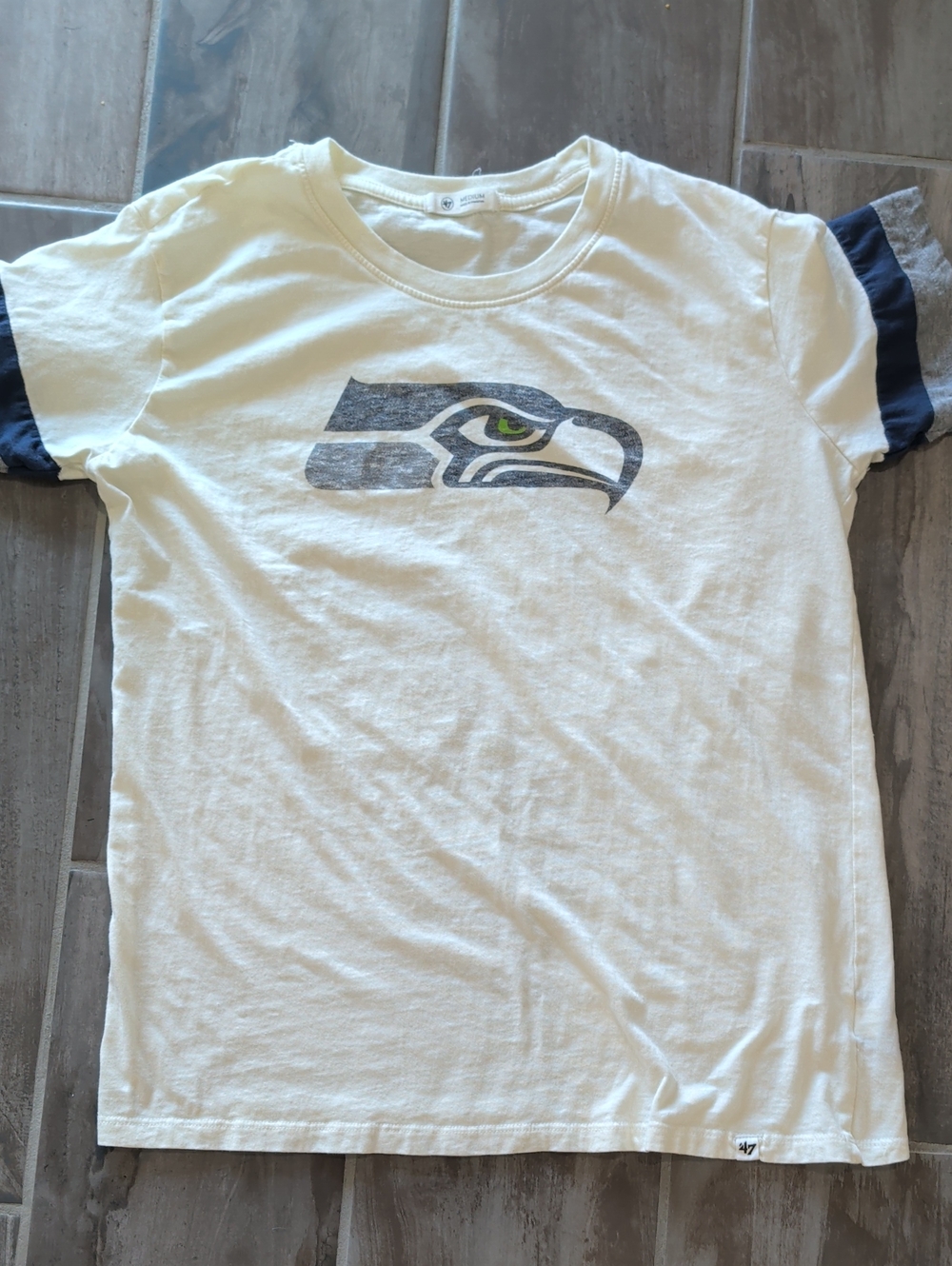 47 Kids White Tee with Navy Sleeve Accents and Seahawks Logo